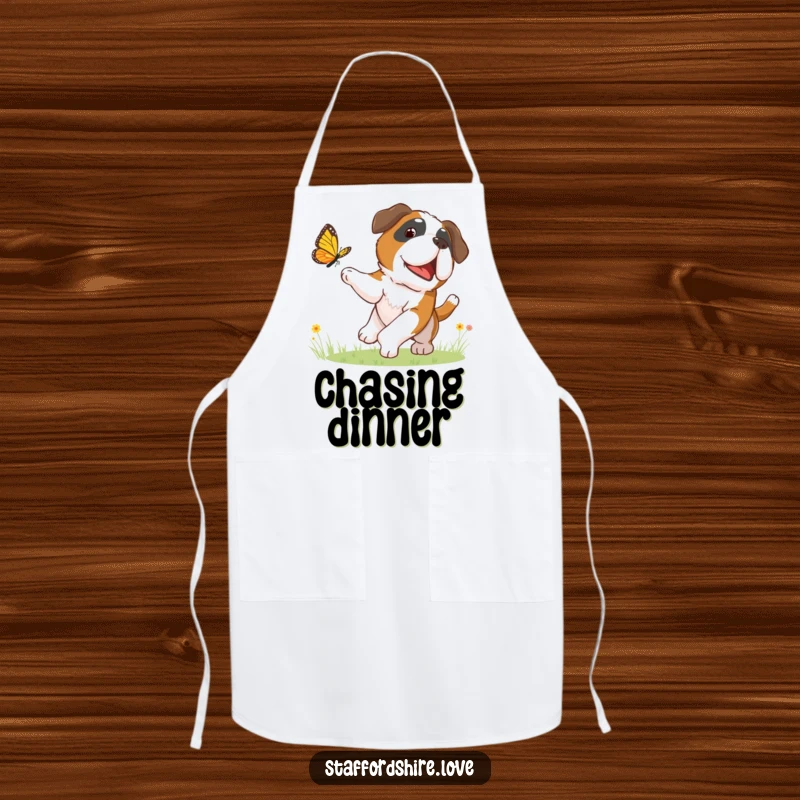 Funny apron featuring a happy Saint Bernard dog chasing a butterfly, perfect for adding a humorous touch to kitchen activities.