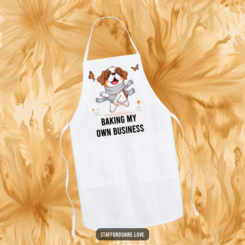 Funny Saint Bernard apron, durable fabric, shows a dog in a scarf chasing a butterfly, great for bakers and cooks.
