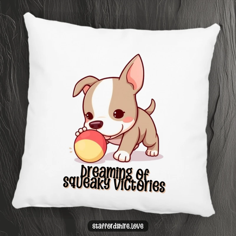 Funny Kawaii Staffordshire Bull Terrier puppy pillow, delightfully engrossed in chasing a squeaky toy, radiating adorable energy.