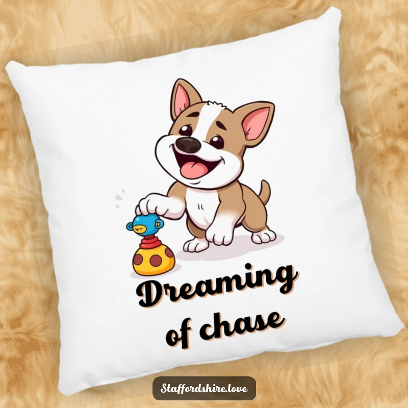 Funny pillow depicting a happy Staffordshire dog playfully pouncing at a toy, adding energetic comfort.