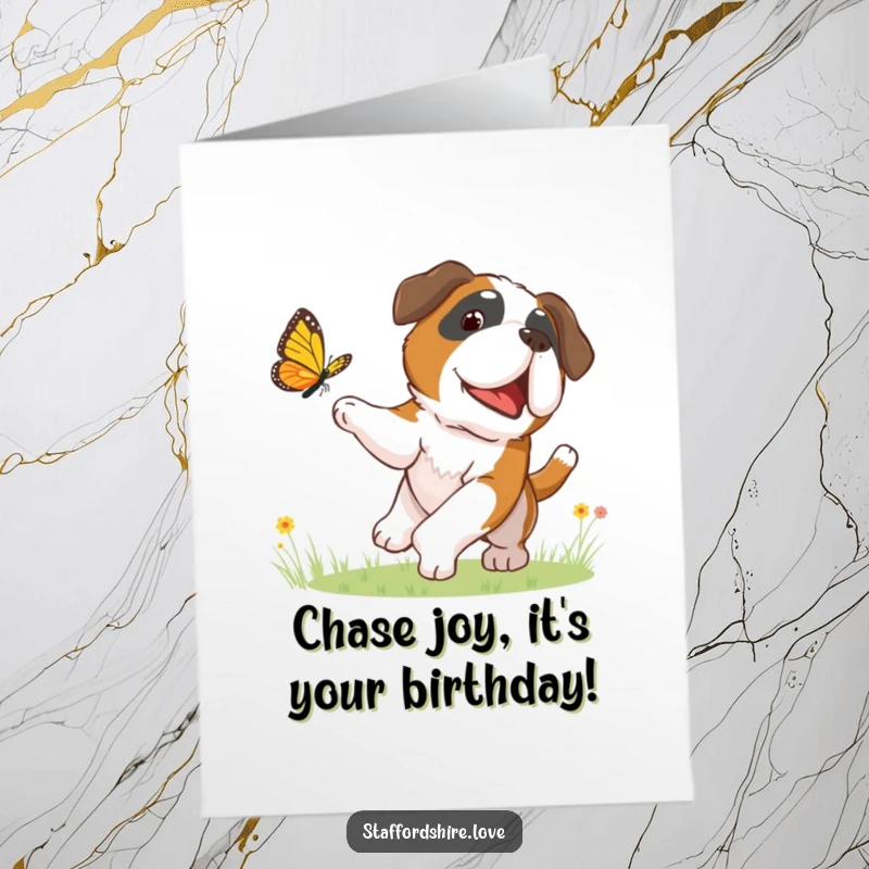 Funny Free Printable Birthday Card: A happy Saint Bernard puppy joyfully chases a colorful butterfly through a sunny meadow.