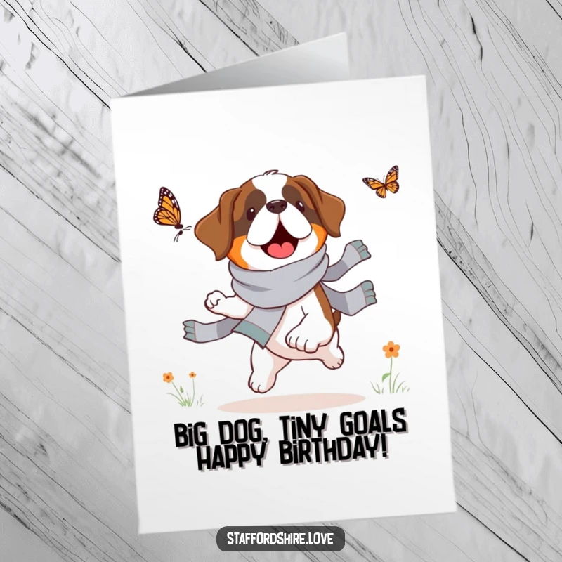 Funny Free Printable Birthday Card featuring a fluffy Saint Bernard in a scarf joyfully chasing a butterfly in a field.
