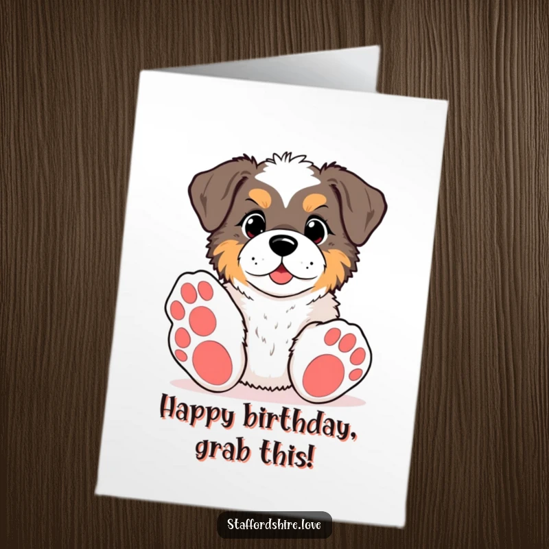 Funny Free Printable Happy Birthday card featuring a kawaii Staffordshire with big paws, enthusiastically reaching for a toy, full of playful anticipation.