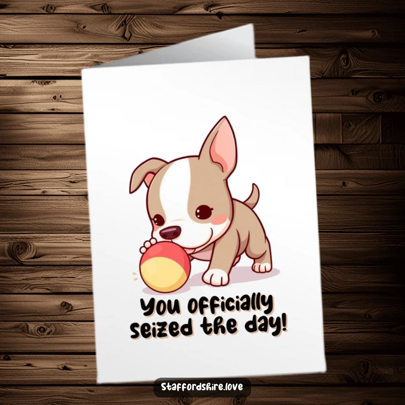 Funny Free Printable Congratulations Card: Cute Kawaii Staffy puppy entangled in a squeaky toy, celebrating a big win.