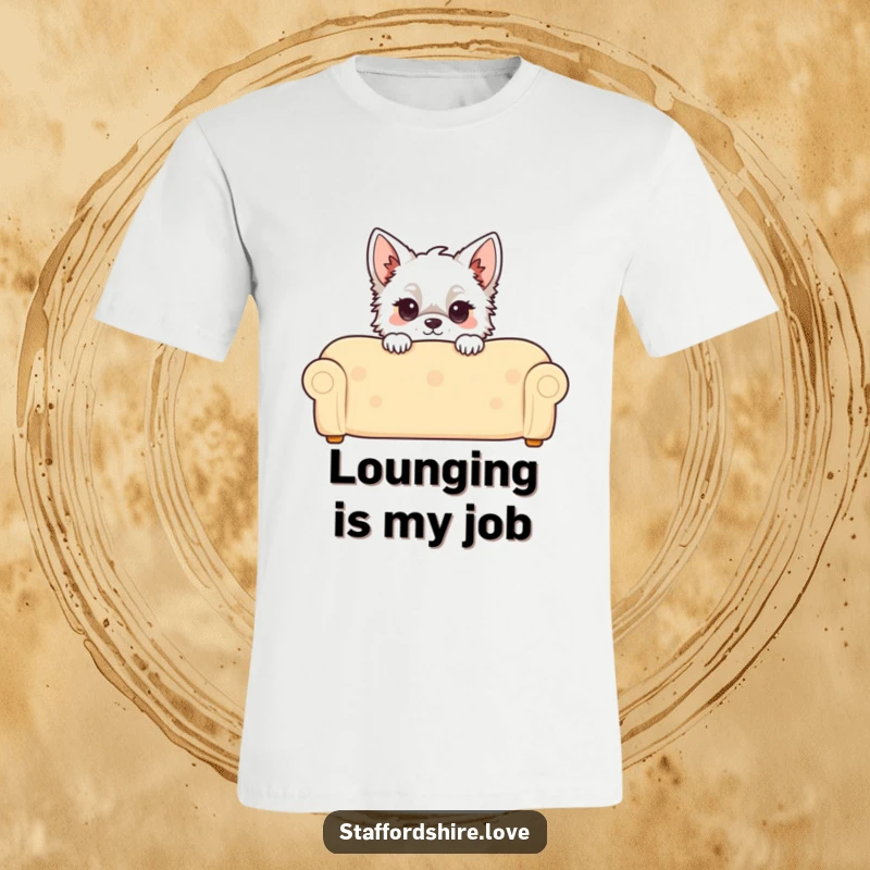 Funny Kawaii Staffordshire T-Shirt, depicting a cute Staffy peeking over a comfy couch, ideal for dog lovers who enjoy playful designs.