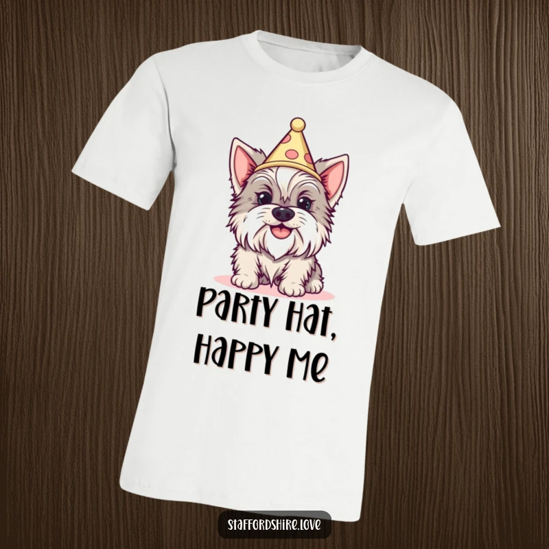 Funny Staffordshire dog with a silly grin wearing a tiny cone hat on a t-shirt. Ideal gift.