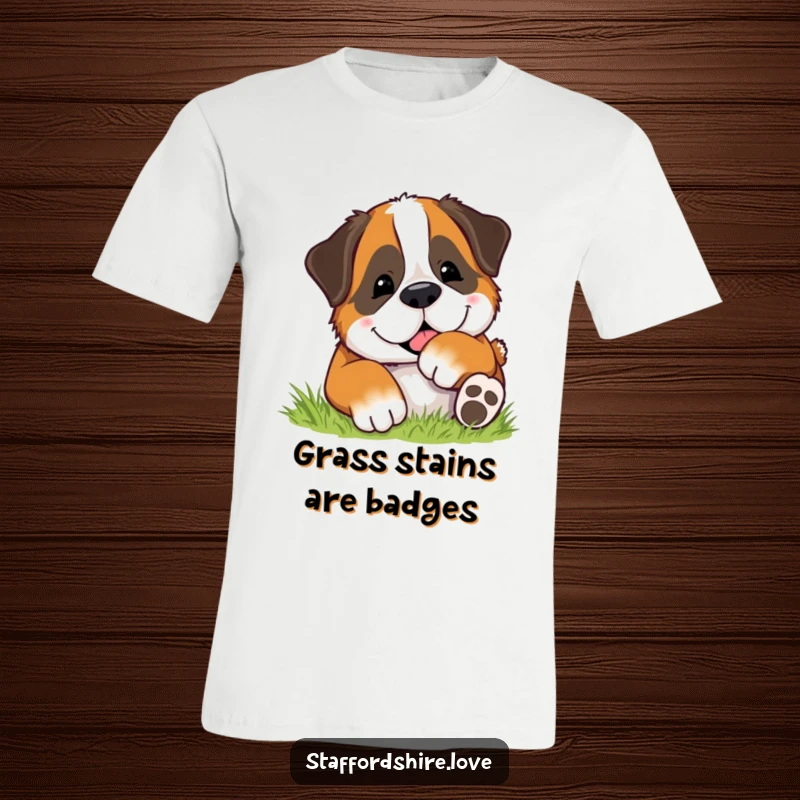 Funny t-shirt depicting a happy Saint Bernard dog rolling playfully and contentedly in a field of soft green grass.