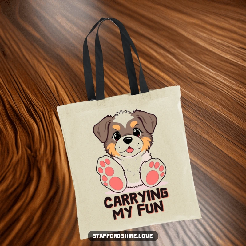 Funny kawaii Staffordshire tote bag, featuring a pup with big paws reaching for a toy, great for shopping and showcasing canine playfulness.