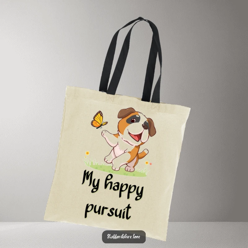 Funny tote bag with a Saint Bernard dog gleefully chasing a butterfly, perfect for carrying daily items with a touch of fun.